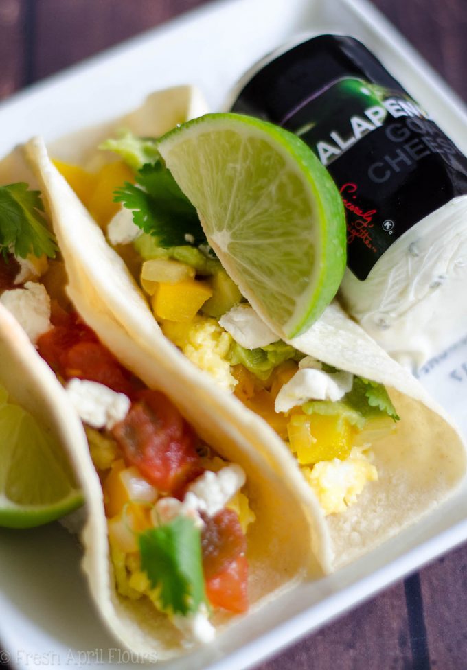 Vegetarian Breakfast Tacos: Mix and match your favorite toppings with the base of creamy goat cheese scrambled eggs and seasoned peppers and onions. Perfect for a breakfast buffet to please a crowd.