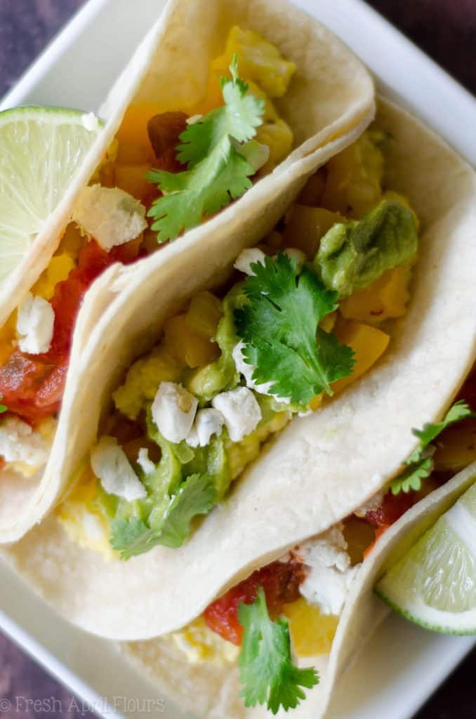 Vegetarian Breakfast Tacos: Mix and match your favorite toppings with the base of creamy goat cheese scrambled eggs and seasoned peppers and onions. Perfect for a breakfast buffet to please a crowd.