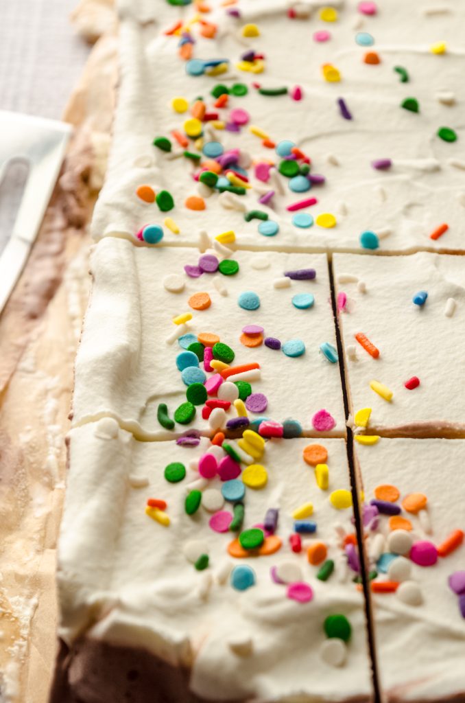 An ice cream sheet cake that has been sliced.