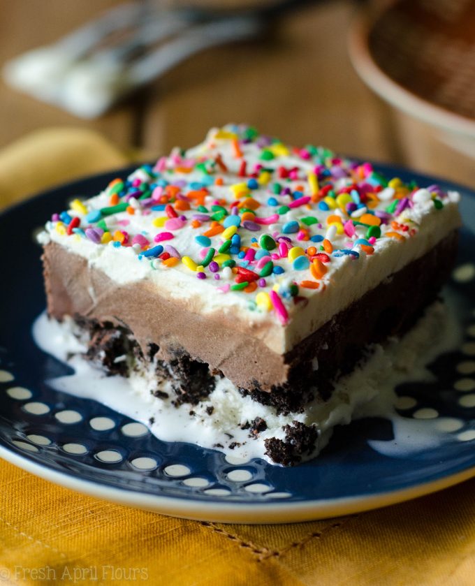 Ice Cream Sheet Cake: An easy recipe for homemade ice cream cake, filled with a crunchy cookie layer. Mix and match your favorite ice cream flavors or be brave and use your own homemade ice cream!