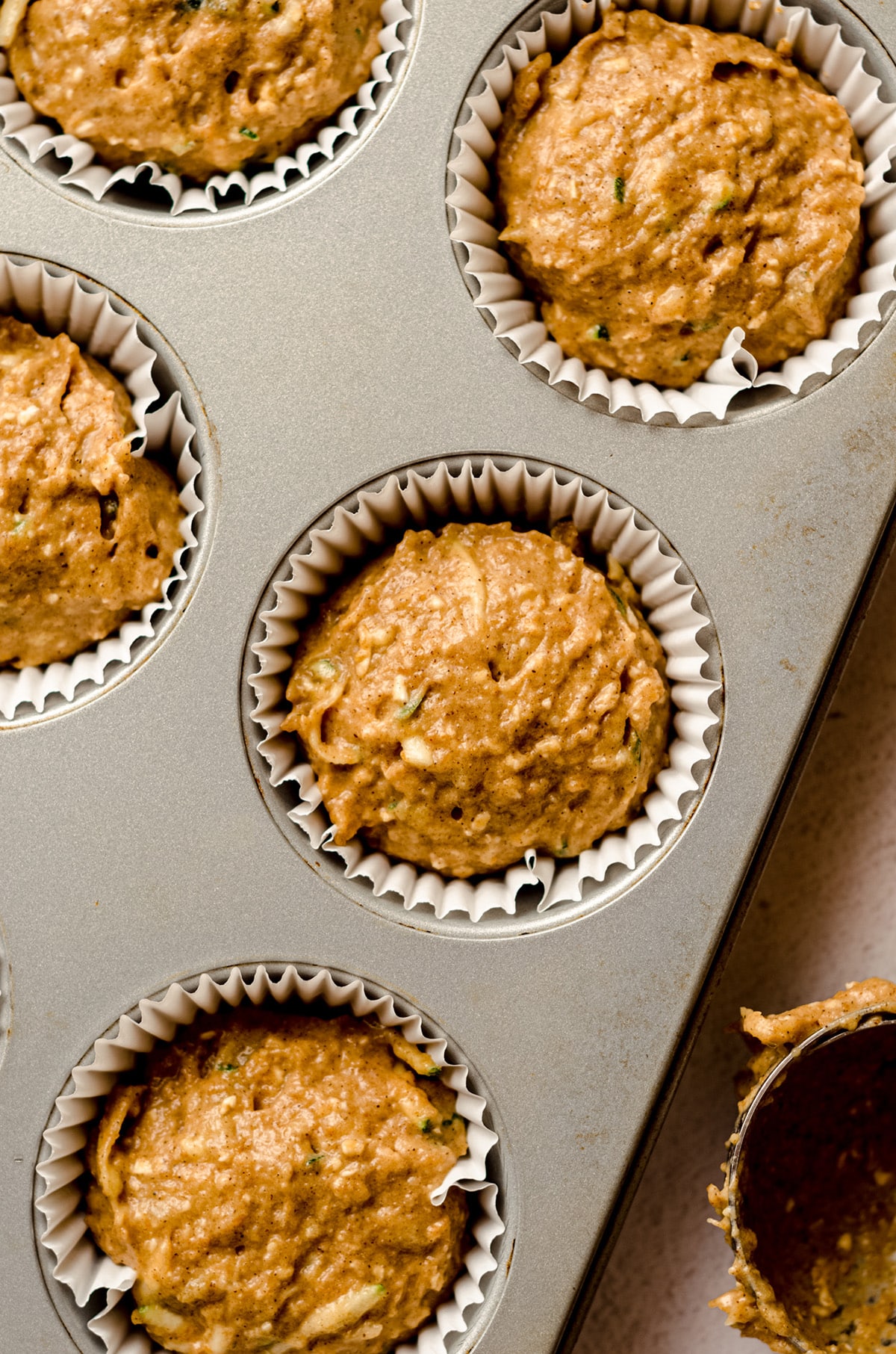 toddler muffin batter in a cupcake pan