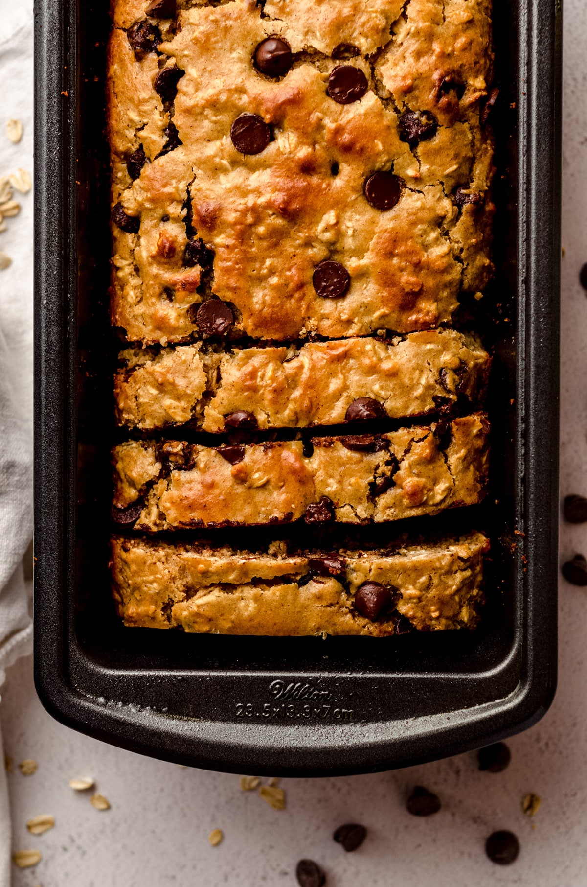 aerial photo of sliced loaf of lactation bread in a loaf pan