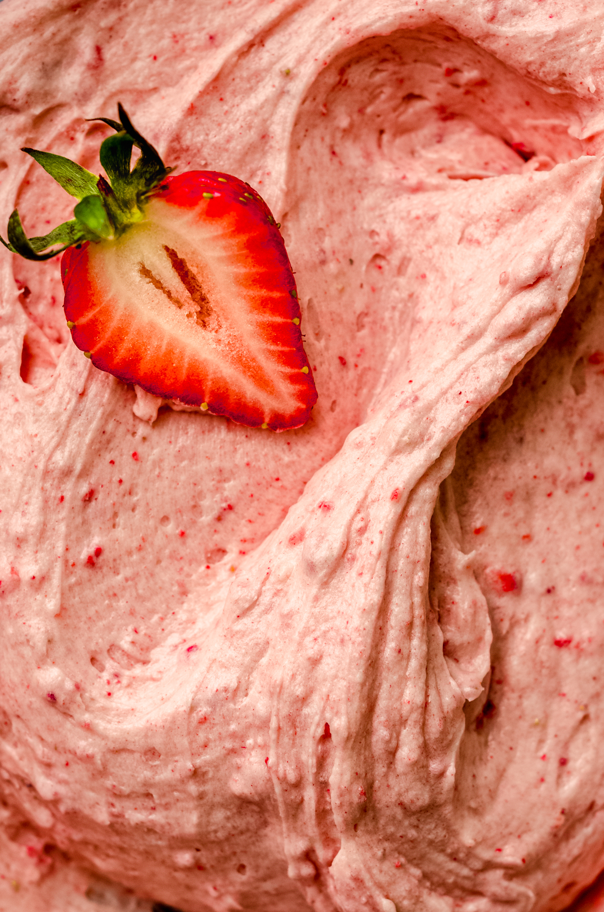 Close up photo of strawberry frosting.