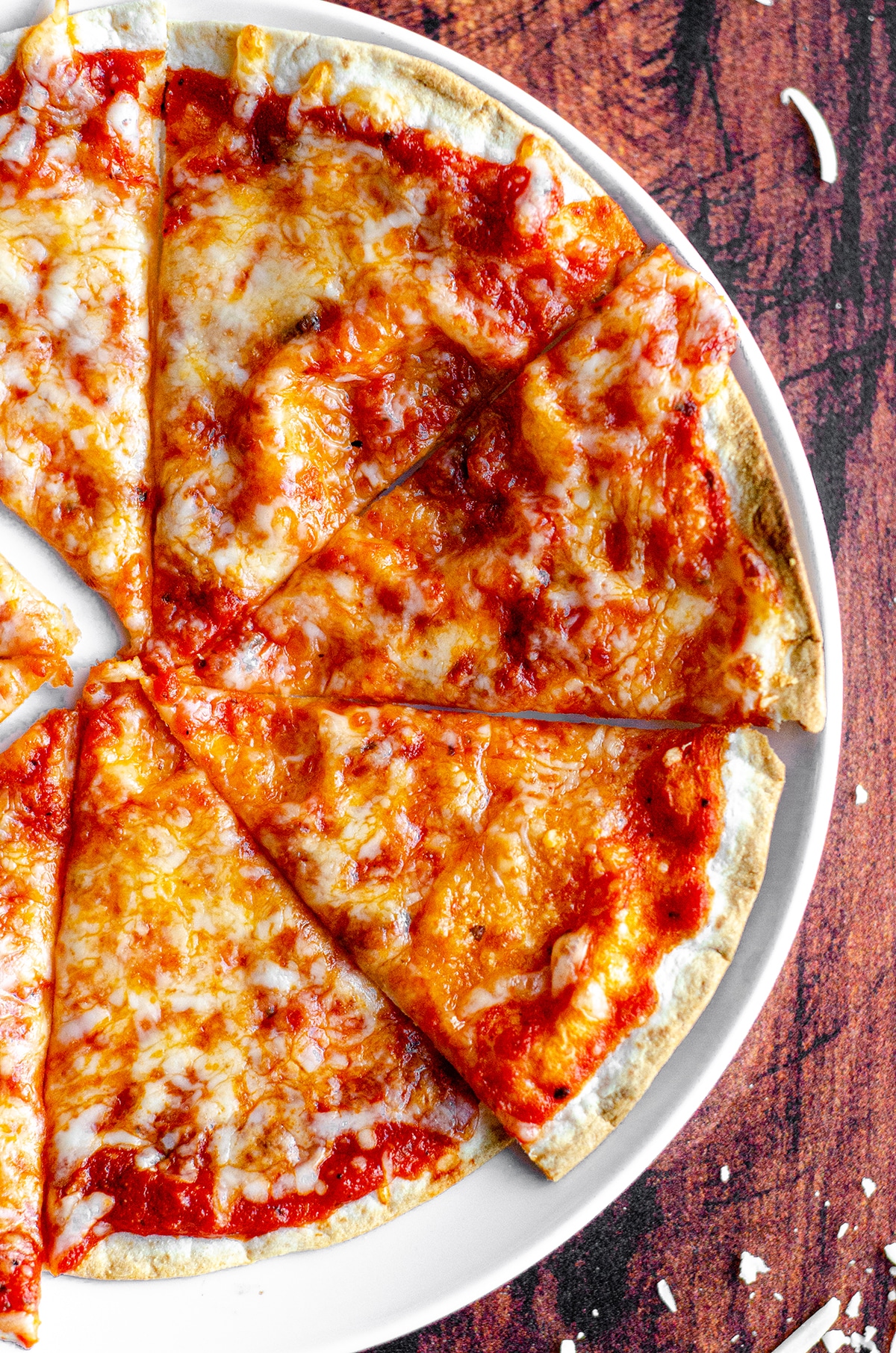 aerial photo of sliced personal tortilla pizza on a plate