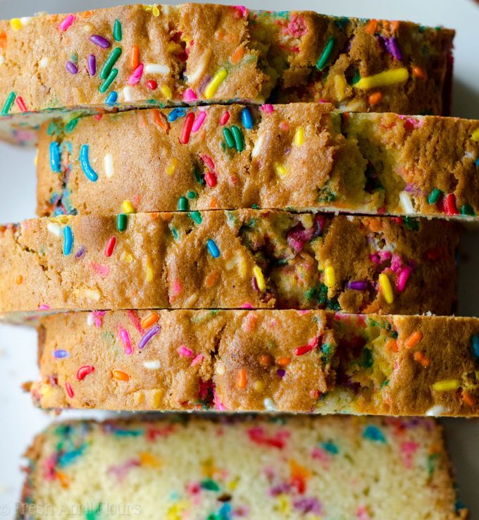 Funfetti Quick Bread: An easy vanilla almond quick bread filled with colorful sprinkles, perfect for any celebration. No mixer required!