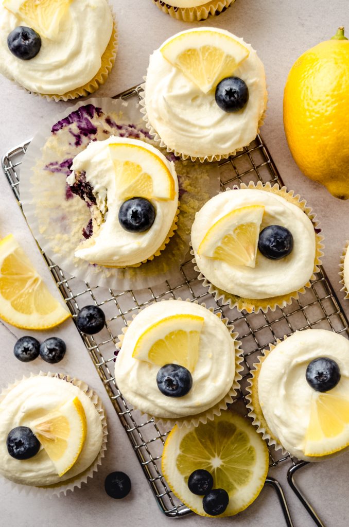 Aerial photo of lemon blueberry cupcakes on a metal grater.