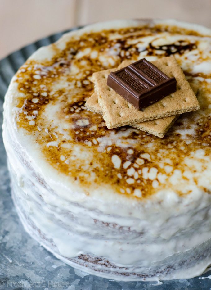 S'mores Layer Cake: Graham cracker cake layered with creamy chocolate ganache, covered in toasted marshmallow buttercream.