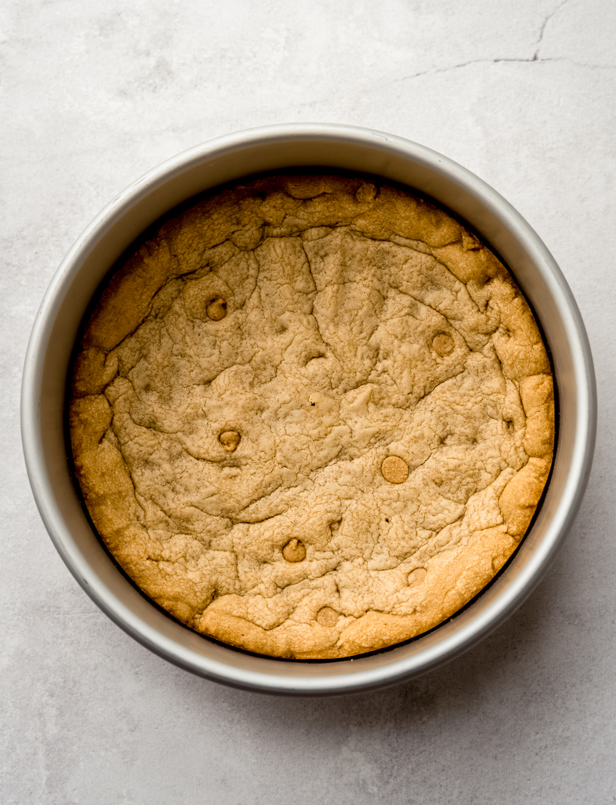 Aerial photo of peanut butter cookie cake in a pan.