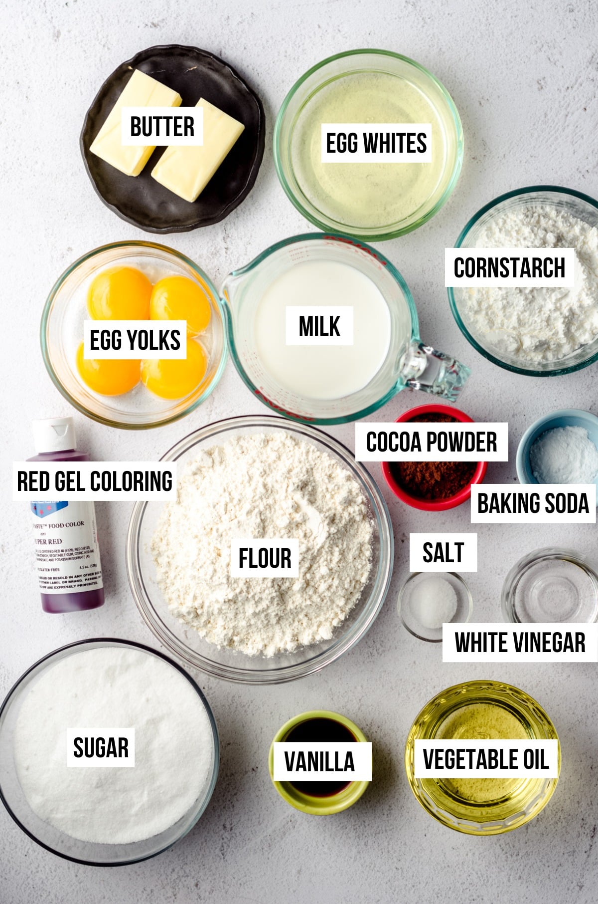 Ingredients for red velvet cake and cupcakes with text overlay.