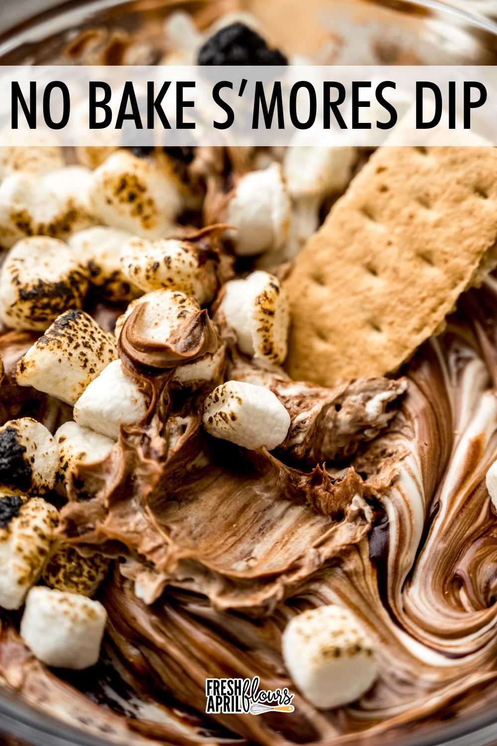 This easy no bake s'mores dip is made with marshmallow buttercream swirled with chocolate ganache. Serve with graham crackers or your favorite crunchy dipper and have the taste of summer all year long! via @frshaprilflours