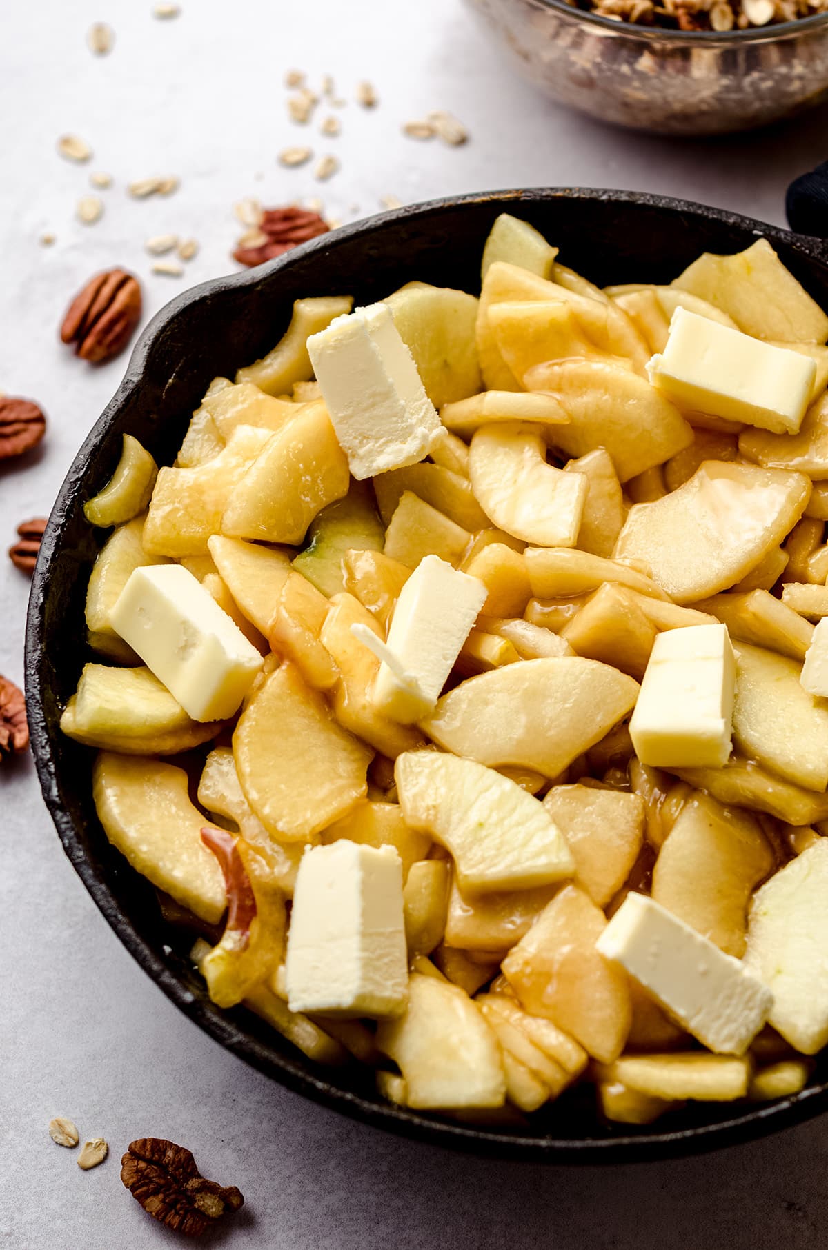 apple and butter chunks in a skillet for apple crisp