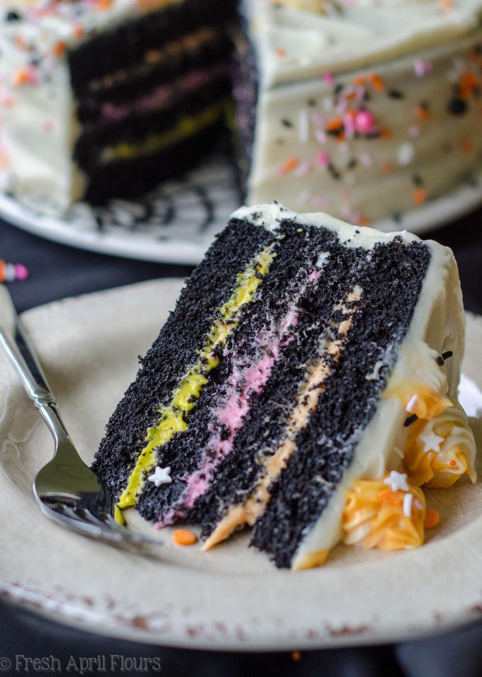 a slice of black velvet layer cake on a plate