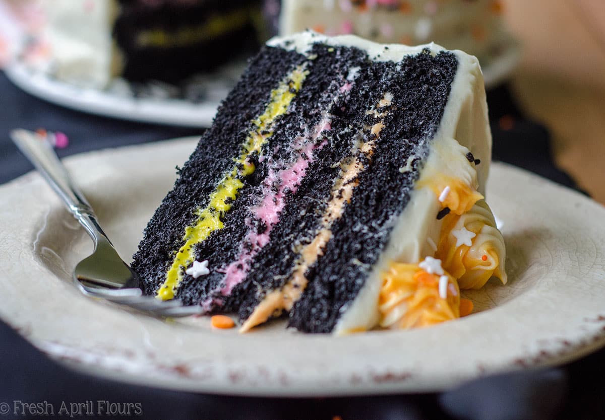 slice of black velvet layer cake on a plate