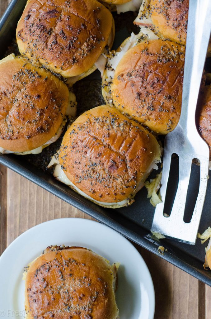 Baked Turkey & Cheese Sliders: Easy turkey and cheese sliders baked in a honey mustard glaze.