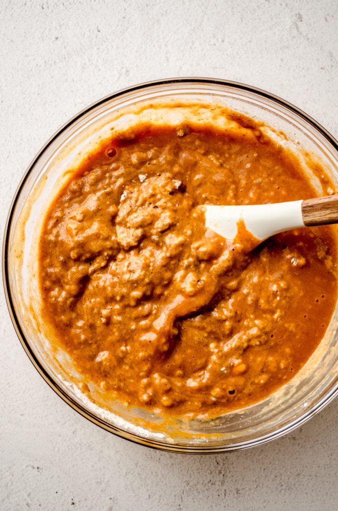 Aerial photo of a bowl of pumpkin bread batter.