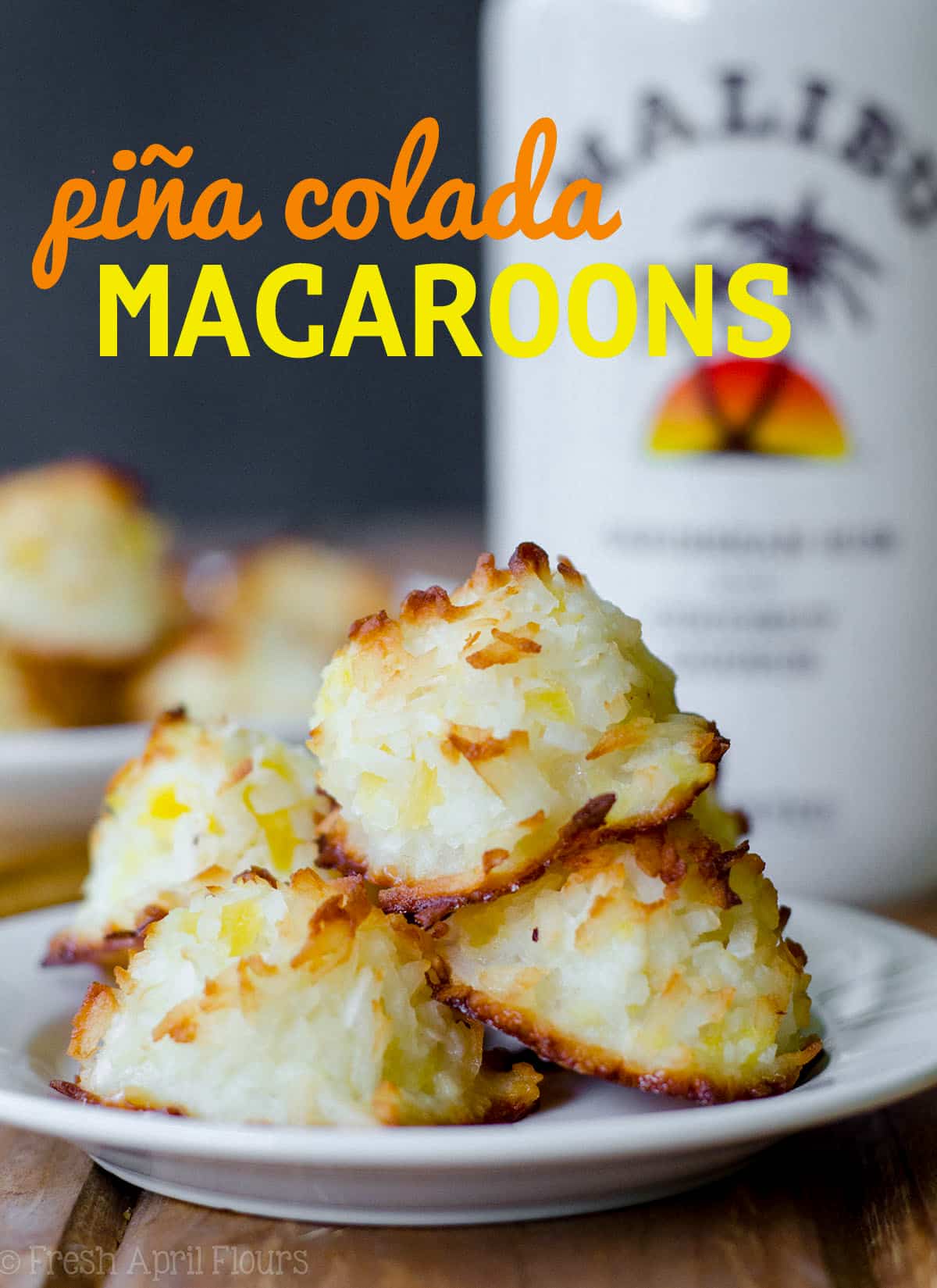Piña Colada Macaroons: Easy coconut macaroons filled with crushed pineapple and spiked with a touch of coconut rum. via @frshaprilflours