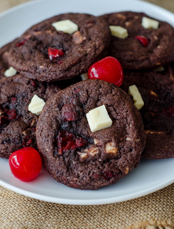 Black Forest Cookies: Soft and chewy chocolate cookies filled with creamy white chocolate chunks and sweet maraschino cherry pieces.