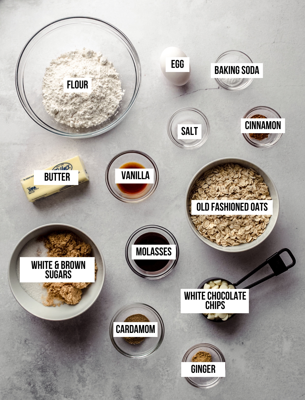 Aerial photo of ingredients to make chai oatmeal cookies with text overlay labeling each ingredient.