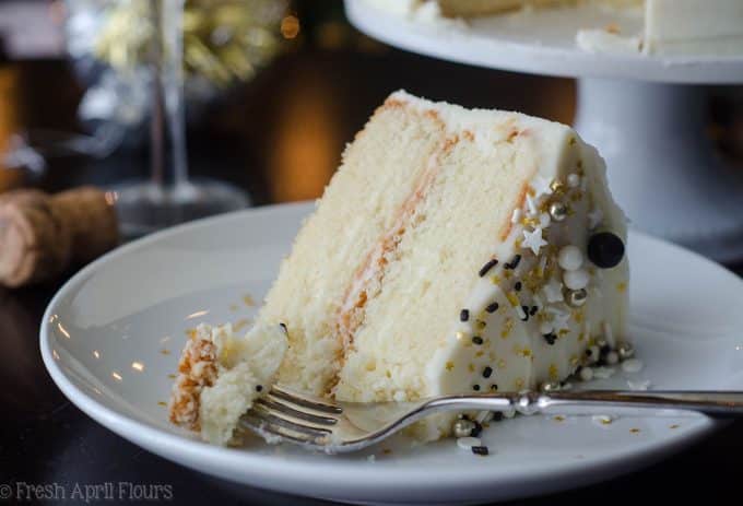 Champagne Layer Cake: Fluffy and moist white cake packed with a punch of real champagne and topped with a spiked buttercream.