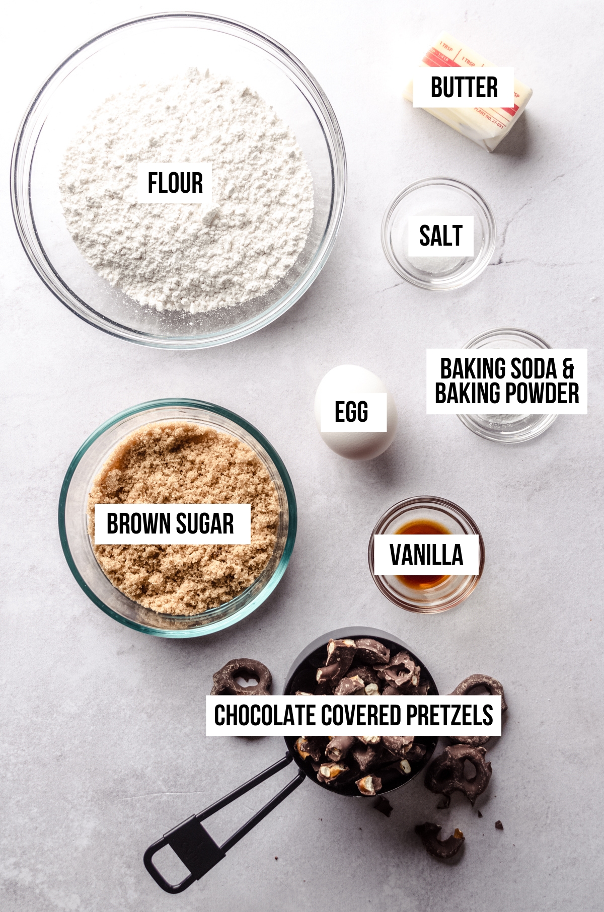 Aerial photo of ingredients for chocolate covered pretzel cookies with text overlay.