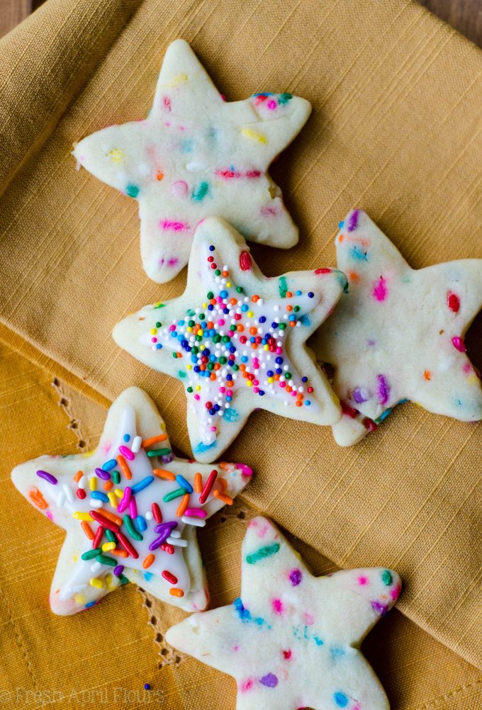 Funfetti Cut-Out Sugar Cookies: No dough chilling necessary for these soft cut-out sugar cookies that are filled with colorful sprinkles and perfect for any occasion. Crisp edges, soft centers, and completely customizable in flavor and shape!