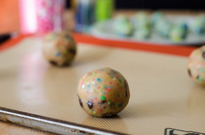 Gender Reveal Cookies: Classic chocolate chip cookies baked with a surprise of colored sprinkles inside perfect for revealing the gender of a baby.