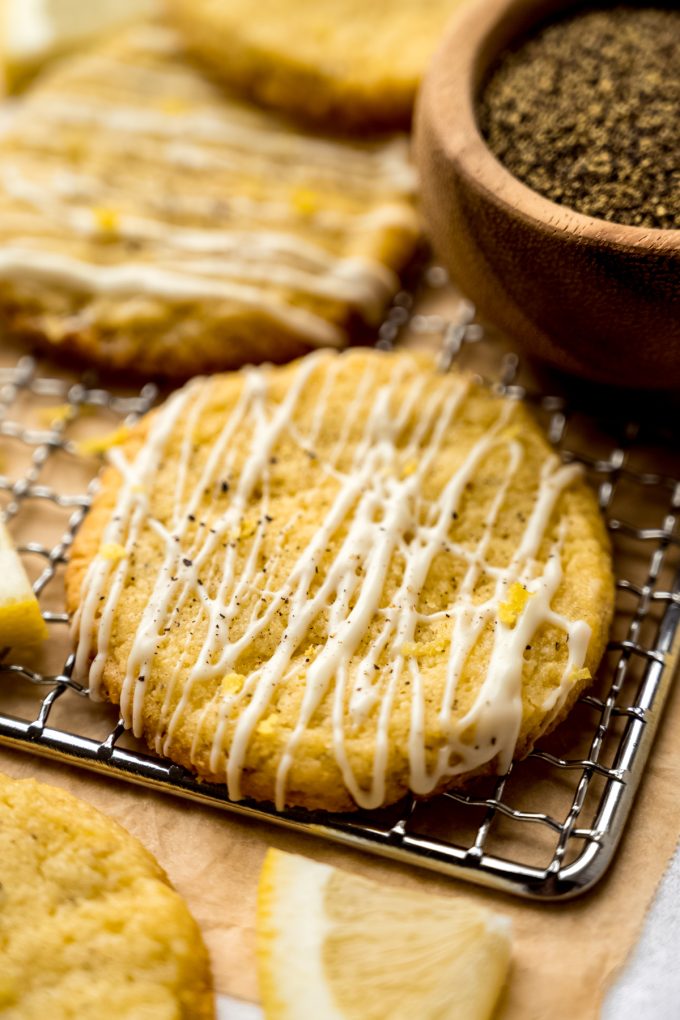 Lemon pepper slice and bake cookies on a cooling rack.