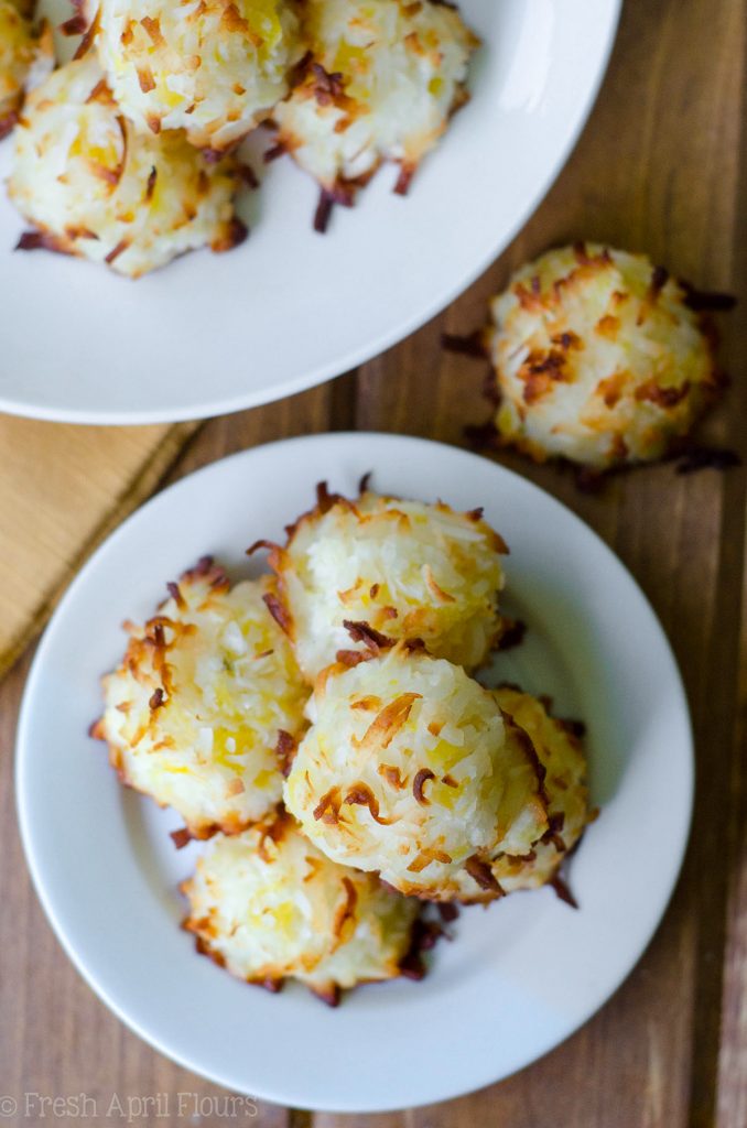 Piña Colada Macaroons: Easy coconut macaroons filled with crushed pineapple and spiked with a touch of coconut rum.