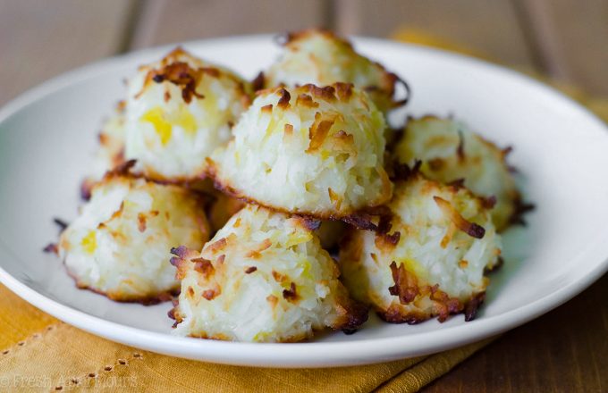 Piña Colada Macaroons: Easy coconut macaroons filled with crushed pineapple and spiked with a touch of coconut rum.