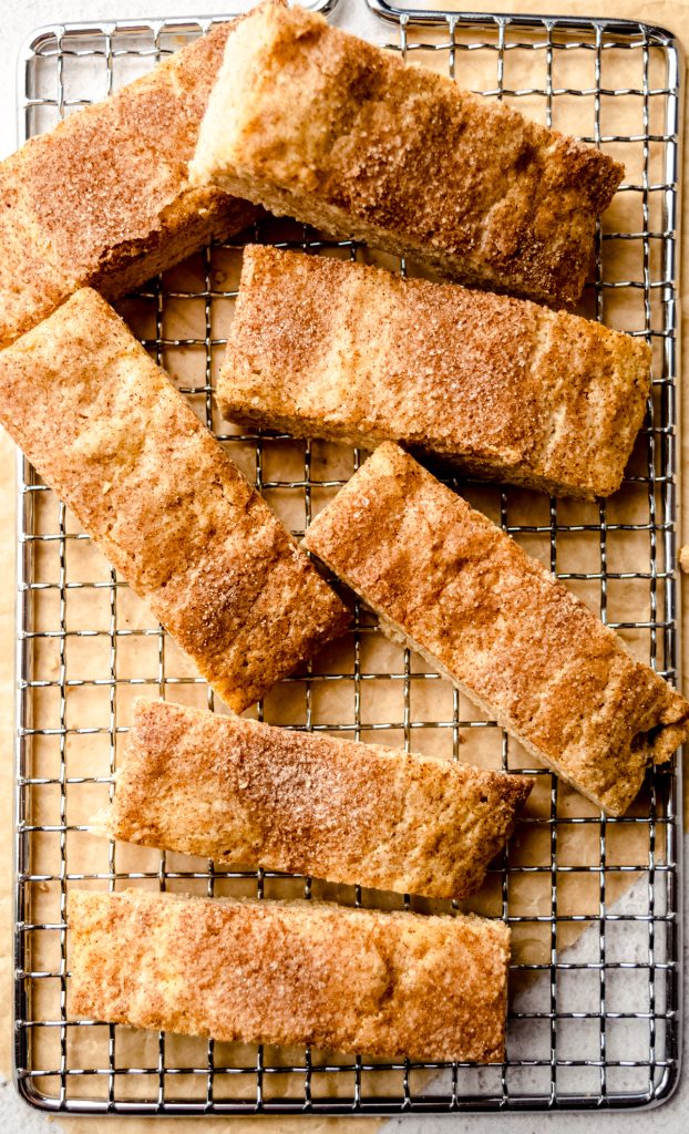 Aerial photo of snickerdoodle biscotti on a wire cooling rack.