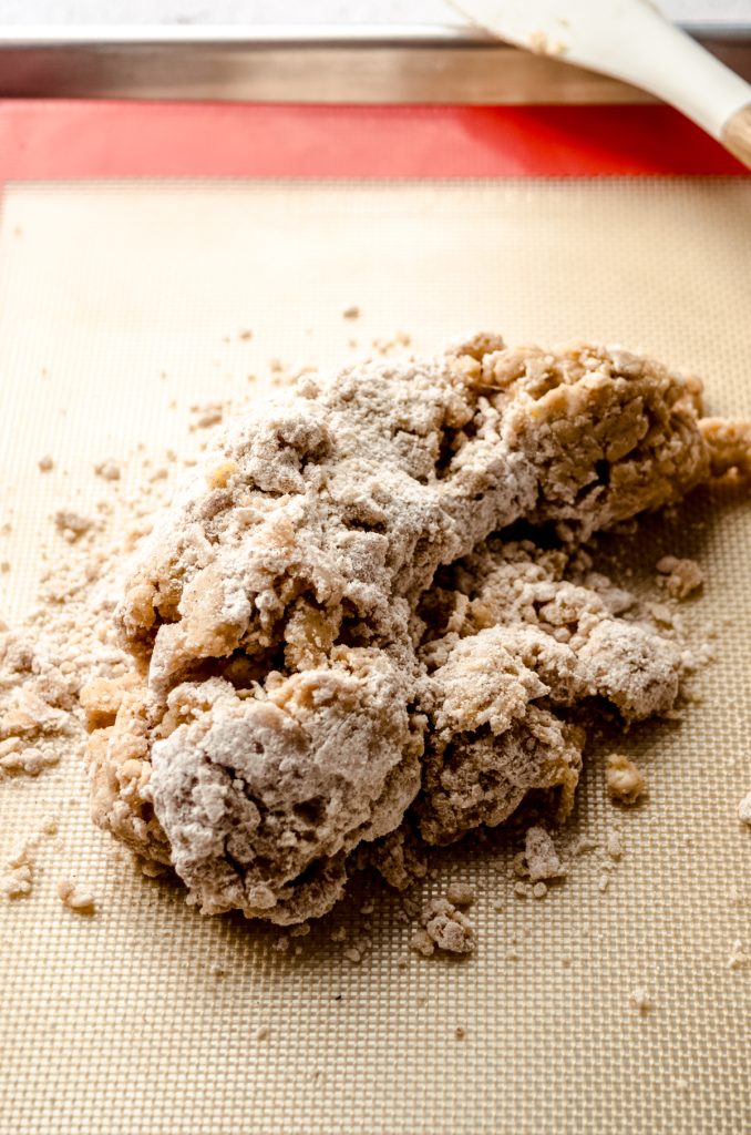 The crumbly dough for biscotti on a baking sheet.