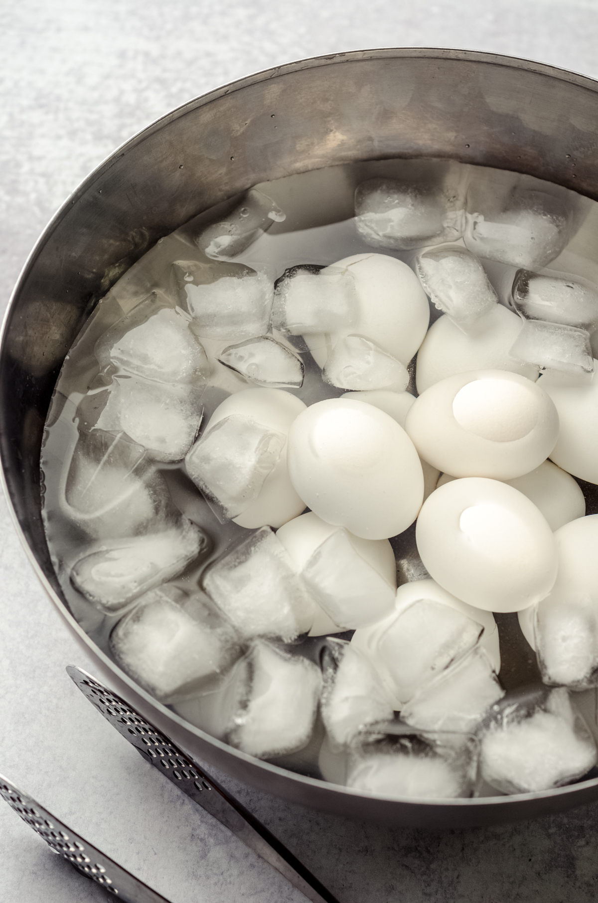 Hard cooked eggs in an ice water bath.