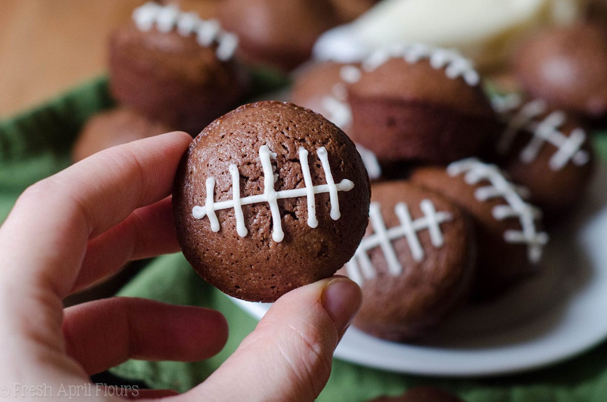 hand holding a football brownie bite