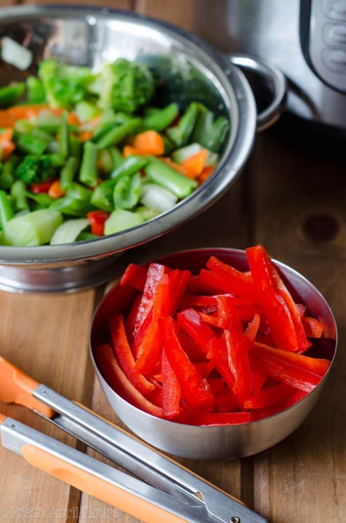 Instant Pot Chicken & Vegetable Stir Fry: A quick and easy version of "stir fry," no pan or stovetop required! Sticky and dense noodles, tender chicken, and crunchy vegetables, ready in about 20 minutes!