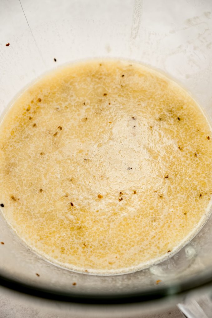 The wet ingredients for anise bread in a bowl.