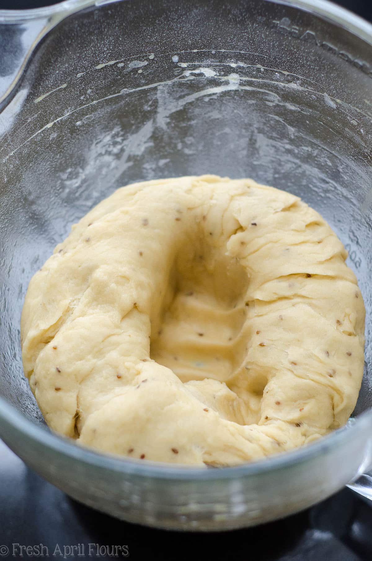 anise bread dough punched down in a bowl