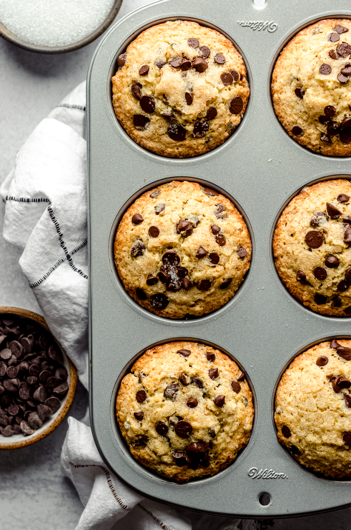 Chocolate chip muffins in a pan.