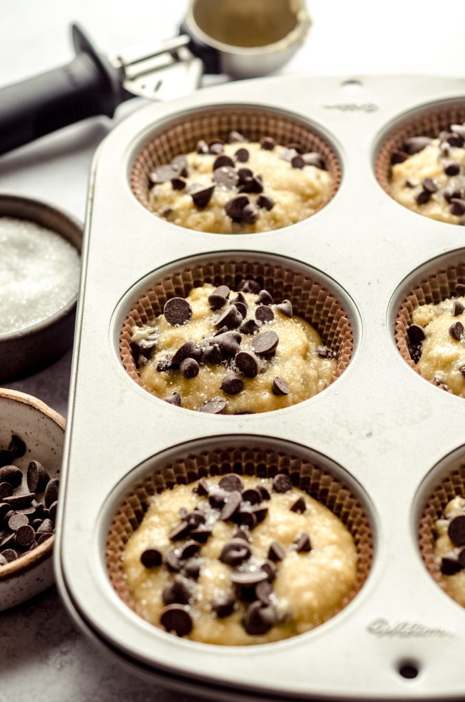 Chocolate chip muffin batter in a pan.