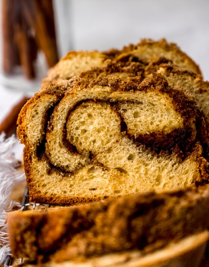 A loaf of cinnamon babka on wire rack.