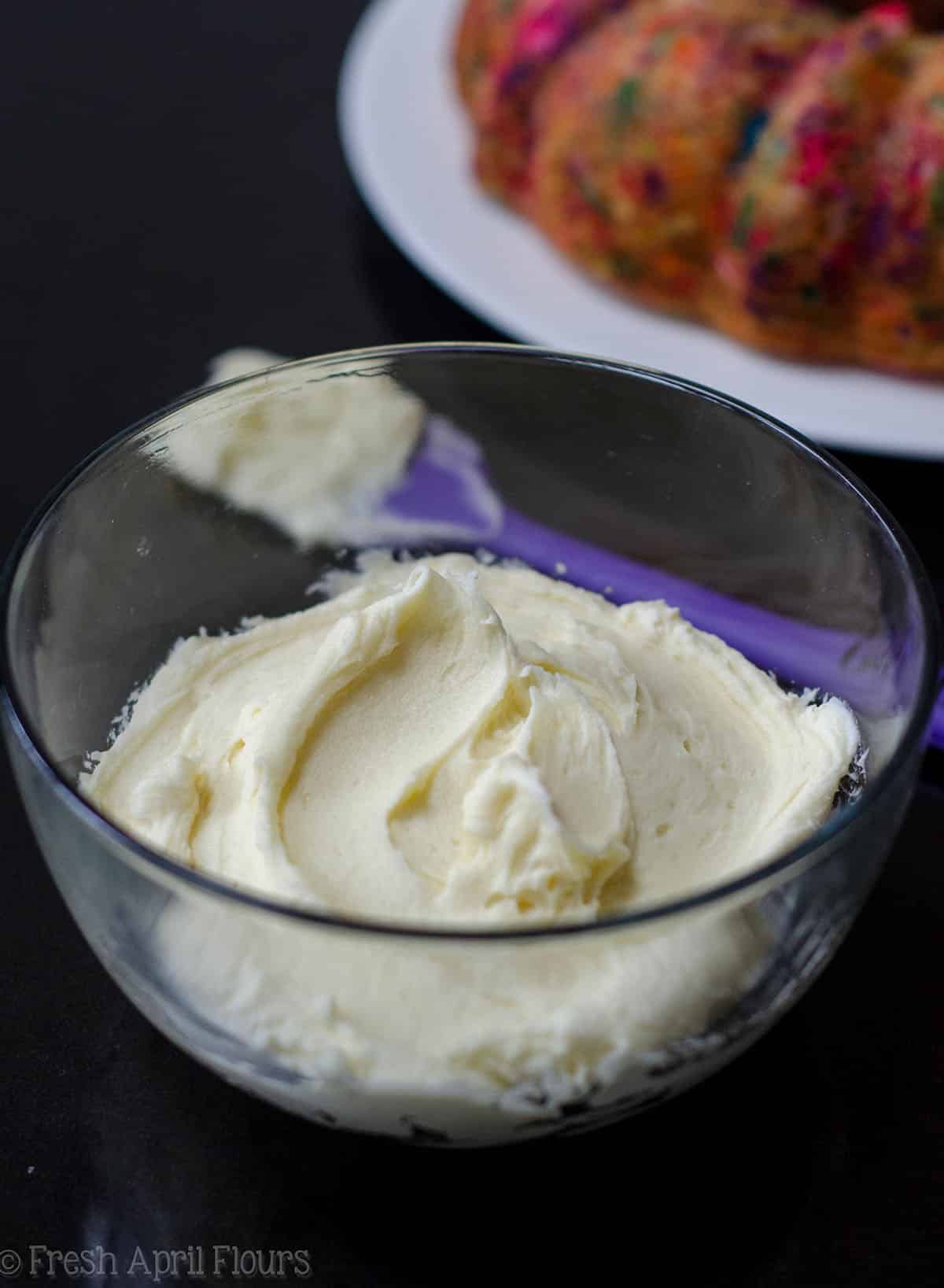 whipped white chocolate ganache frosting in a bowl