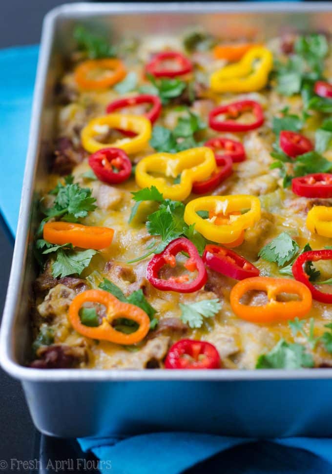 Enchilada Breakfast Bake: Seasoned scrambled eggs and vegetables combined with spicy chorizo, and layered between corn tortillas and enchilada sauce for an easy and flavorful breakfast dish.