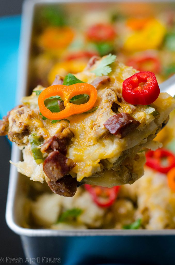 Enchilada Breakfast Bake: Seasoned scrambled eggs and vegetables combined with spicy chorizo, and layered between corn tortillas and enchilada sauce for an easy and flavorful breakfast dish.