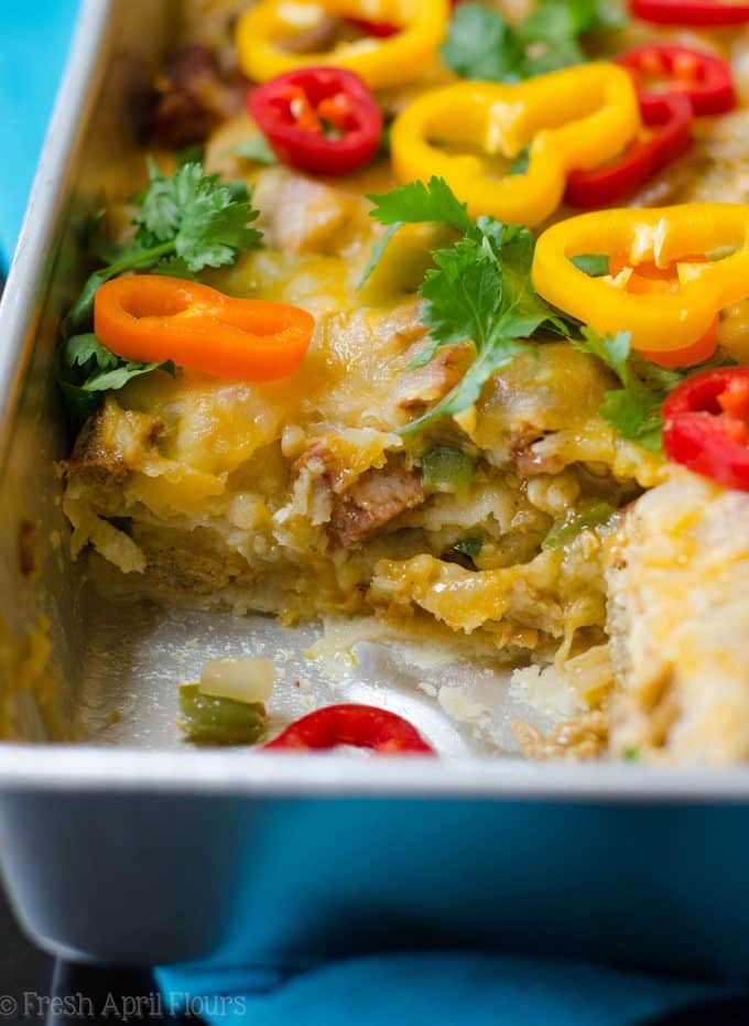 Enchilada Breakfast Bake: Seasoned scrambled eggs and vegetables combined with spicy chorizo, and layered between corn tortillas and enchilada sauce for an easy and flavorful breakfast dish.