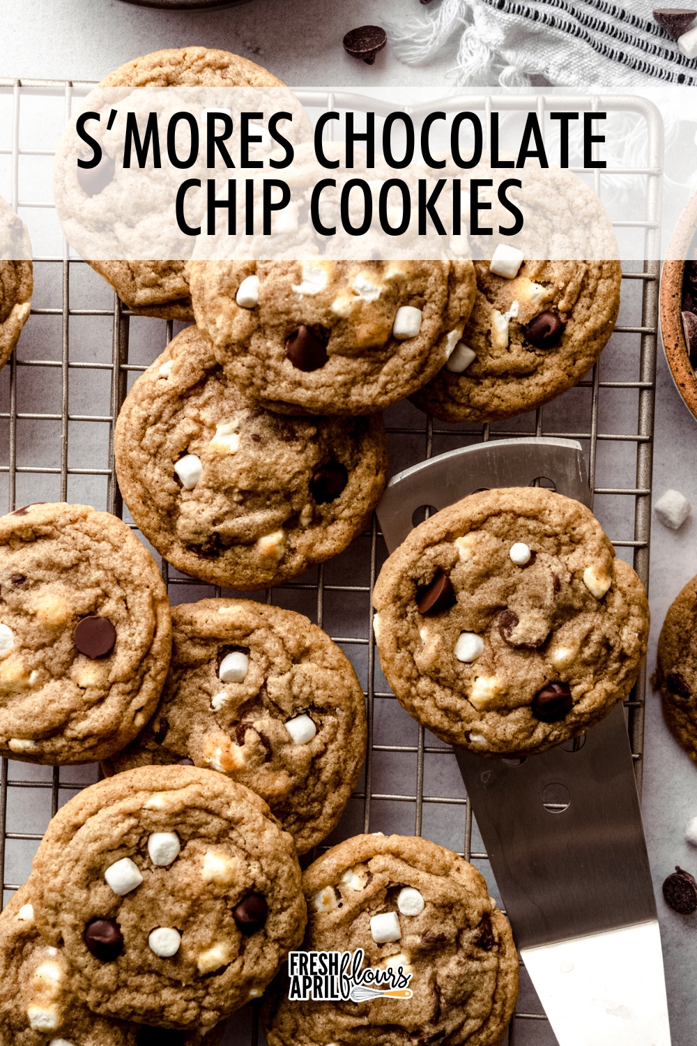 These soft and chewy s'mores cookies start with a brown sugary and cinnamon-spiced graham cracker base with plenty of chocolate chips and marshmallow bits packed into every gooey bite.  via @frshaprilflours