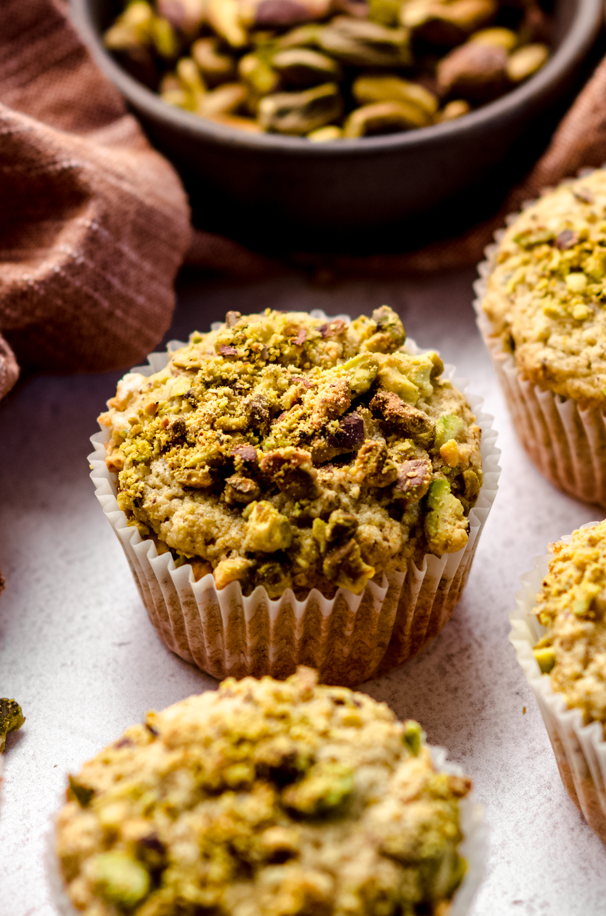 A closeup of a pistachio muffin.