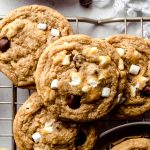 Aerial photo of s'mores chocolate chip cookies on a wire cooling rack.