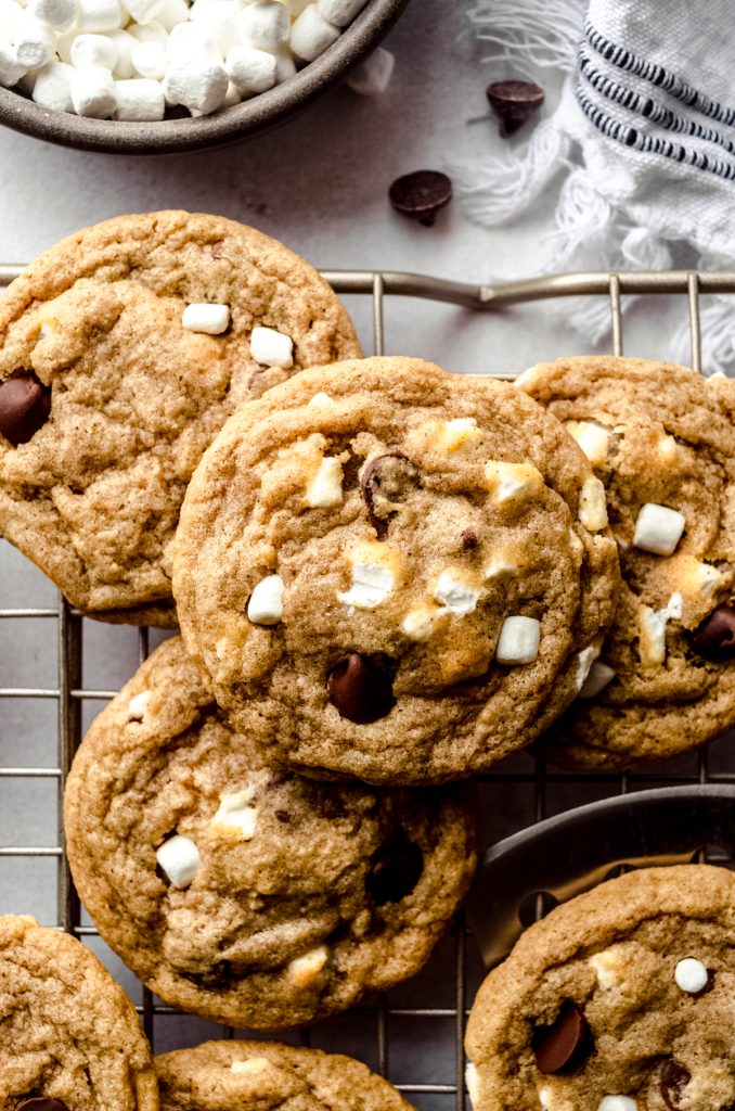 Aerial photo of s'mores chocolate chip cookies on a wire cooling rack.