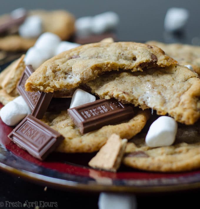 S'mores Cookies: Classic milk chocolate chip cookies scattered with gooey marshmallows and crunchy graham cracker crumbs.