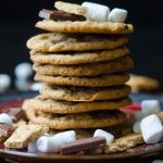 S'mores Cookies: Classic milk chocolate chip cookies scattered with gooey marshmallows and crunchy graham cracker crumbs.