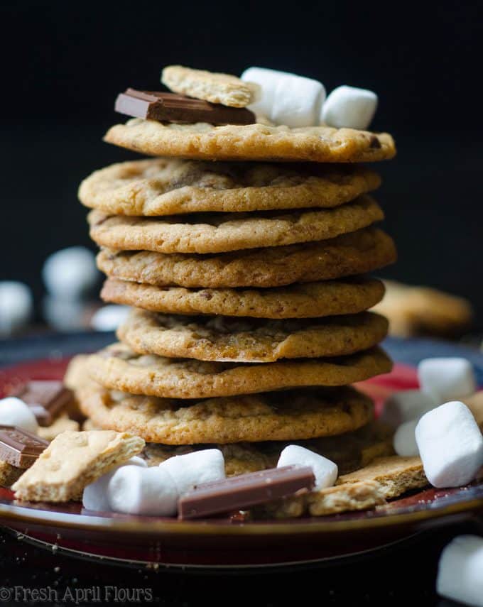 S'mores Cookies: Classic milk chocolate chip cookies scattered with gooey marshmallows and crunchy graham cracker crumbs.